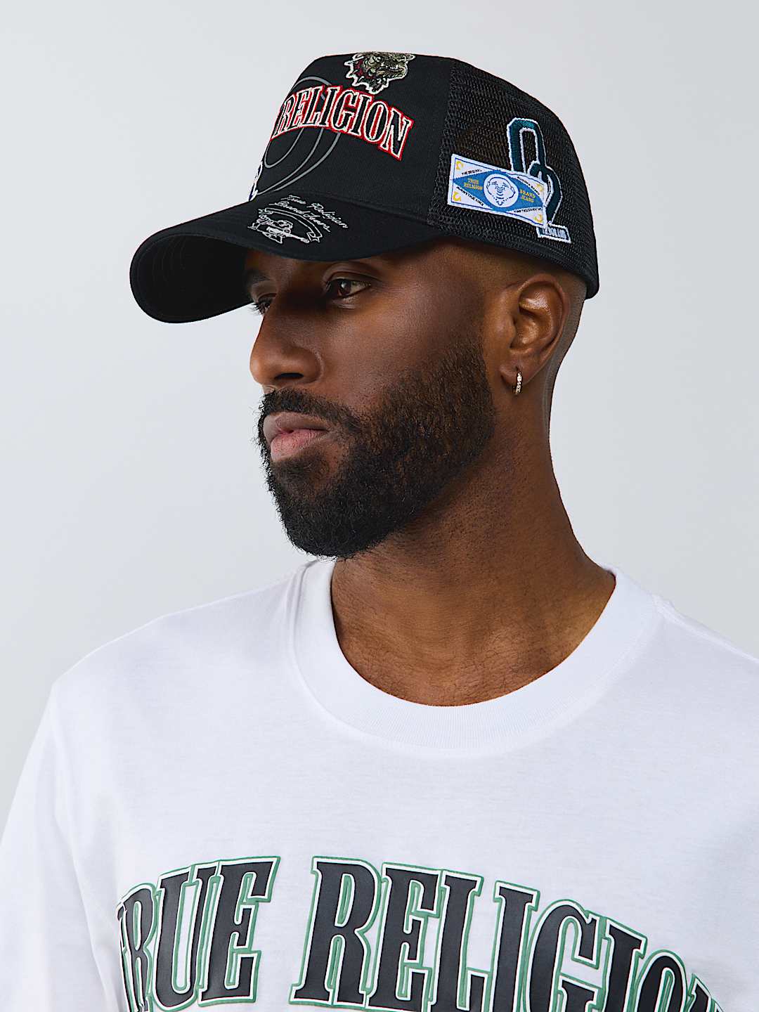True Religion -Multi-logo Trucker Hat