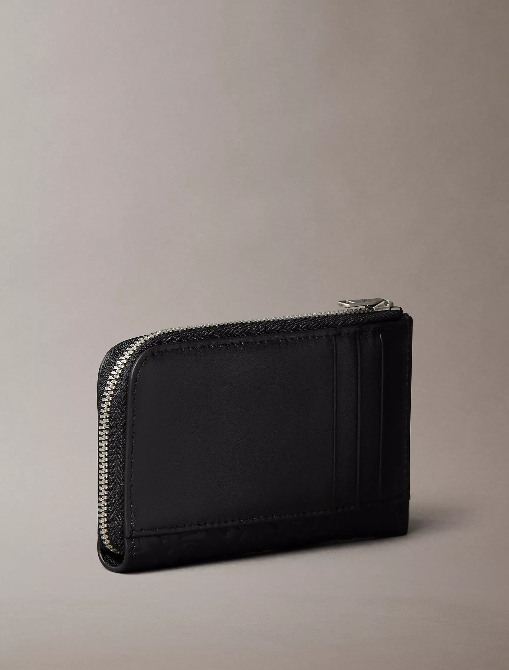 Calvin Klein - Embossed Allover Monogram Zip Wallet