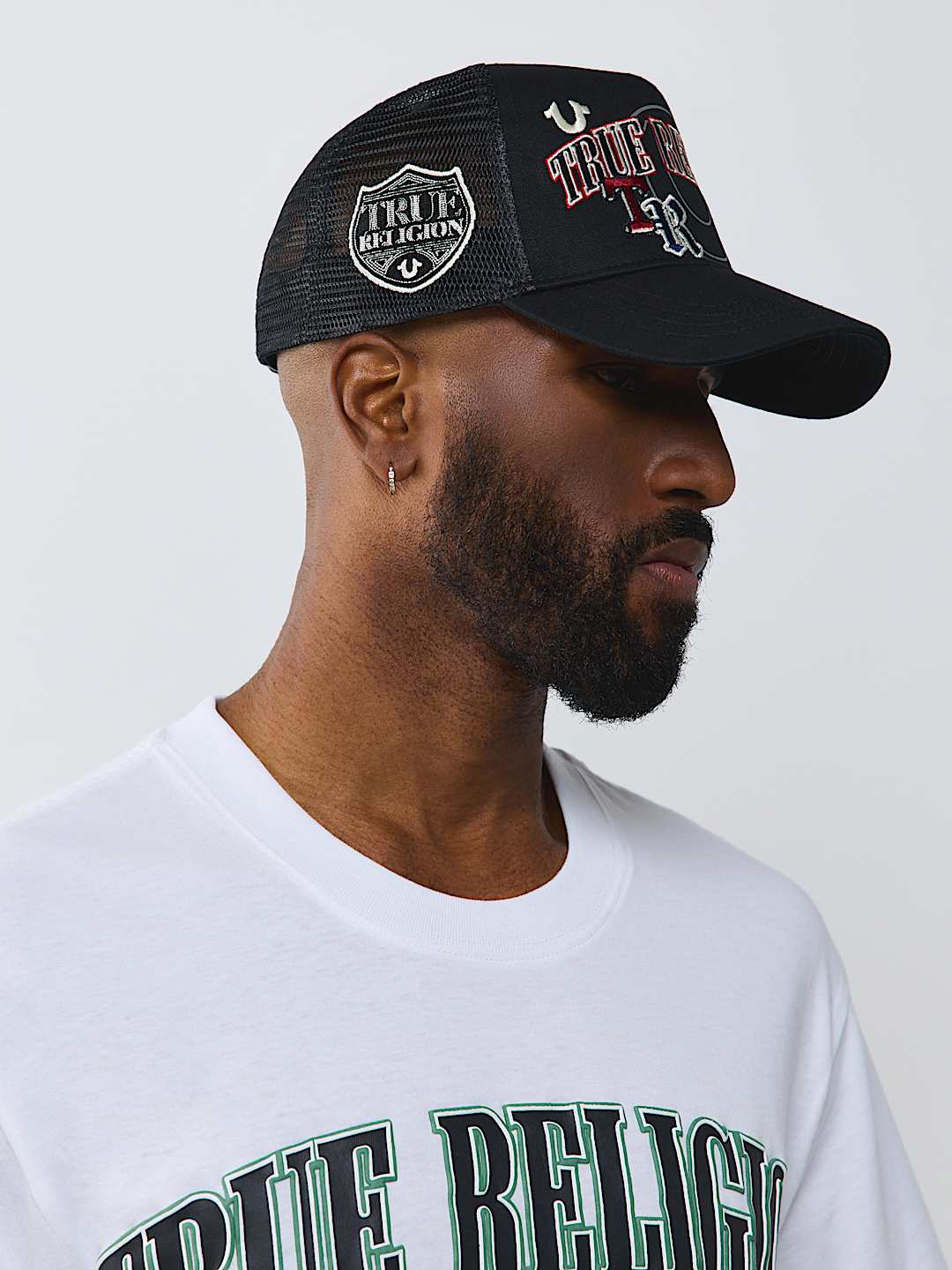 True Religion -Multi-logo Trucker Hat